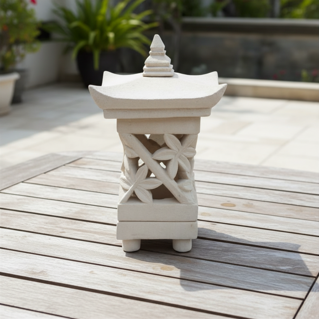 Carved with fern leaf design on a timber outdoor deck surrounded by tropical garden greenery