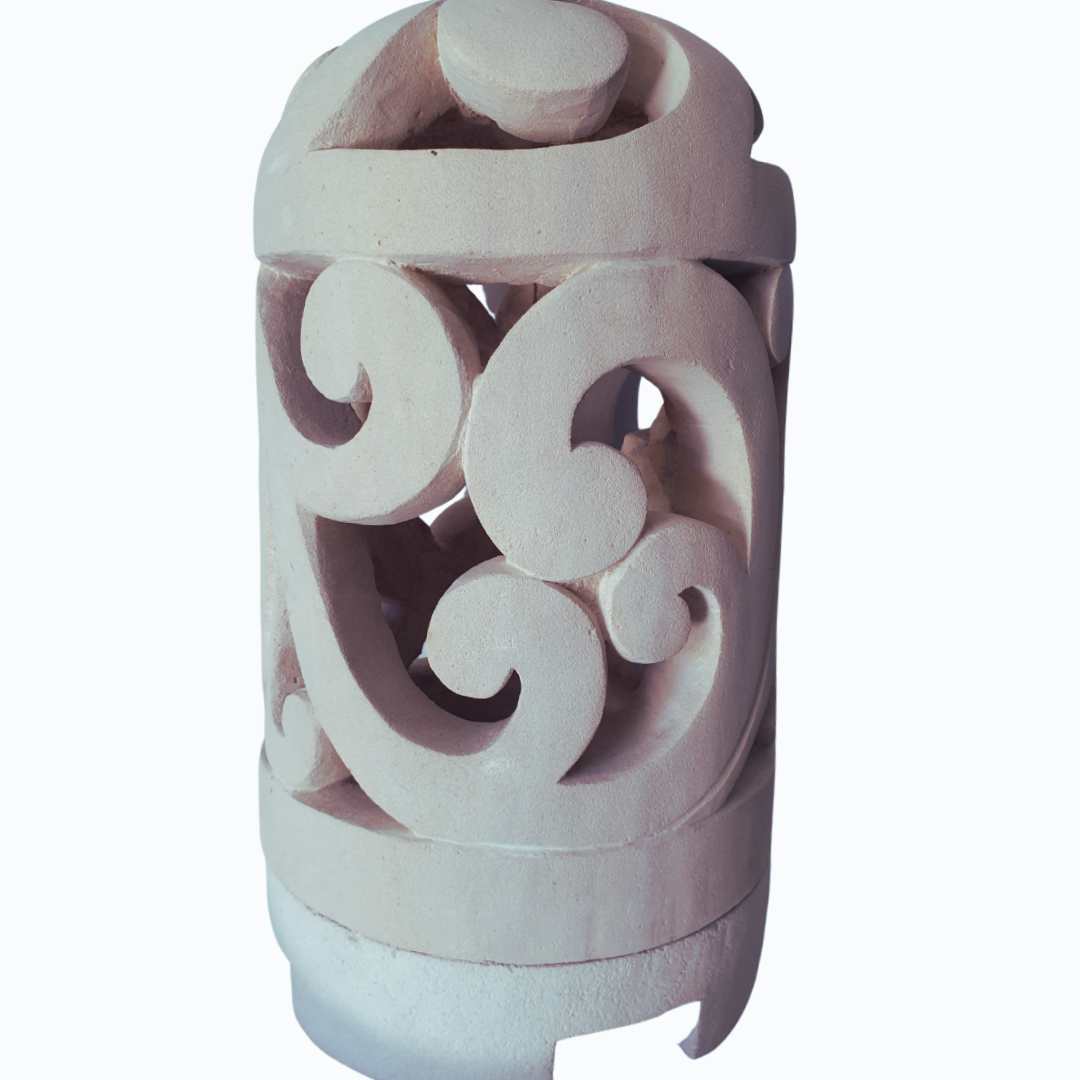 Decorative ceramic lantern with intricate patterns on a white background