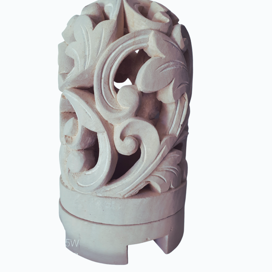 Decorative white limestone carvings with intricate patterns on a white background