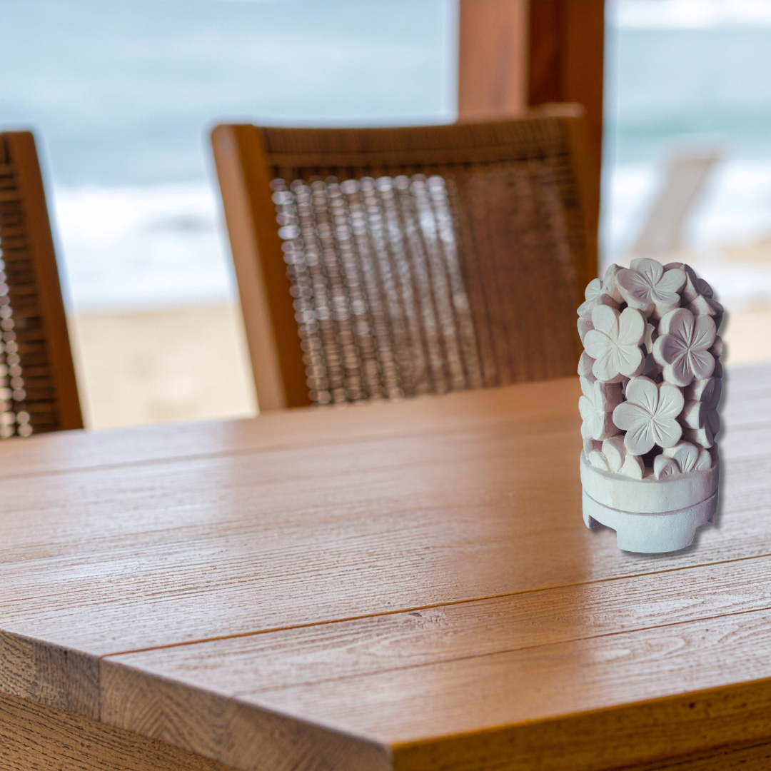 Wooden table with a decorative item on it, blurred background