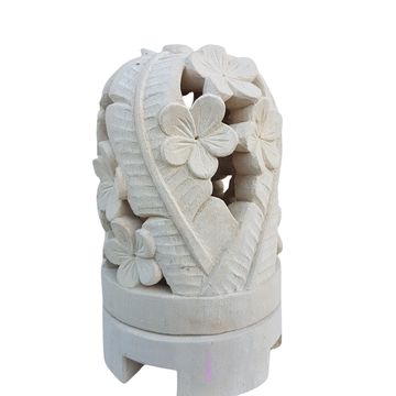 White limestone incense burner with floral carvings on a white background