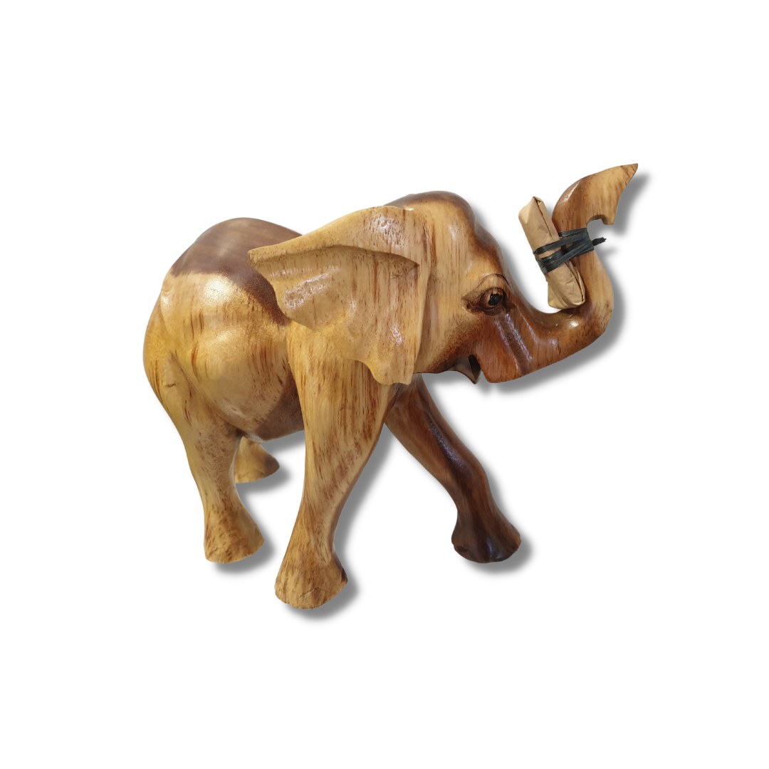 Handcrafted solid wood elephant figurine with trunk raised, natural two-tone light and dark brown grain finish, photographed on a white background. Tusks are included separately for safe delivery