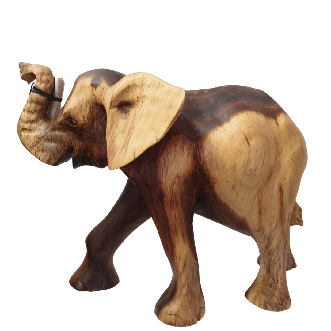 Side view of a hand-carved figurine with trunk raised, deep dark brown body with contrasting pale cream ears and face, tusks included separately for safe delivery, on a white background. STYLE 3 