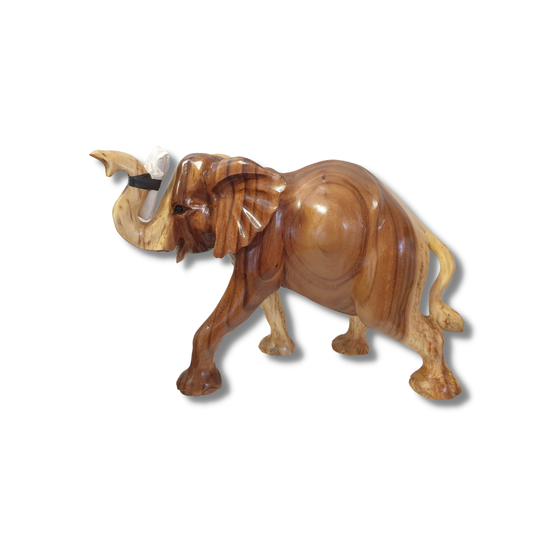  Side view of a hand-carved figurine in a walking pose, trunk raised with ivory tusks attached, warm two-tone brown and golden grain finish, on a white backgroundSTYLE 2