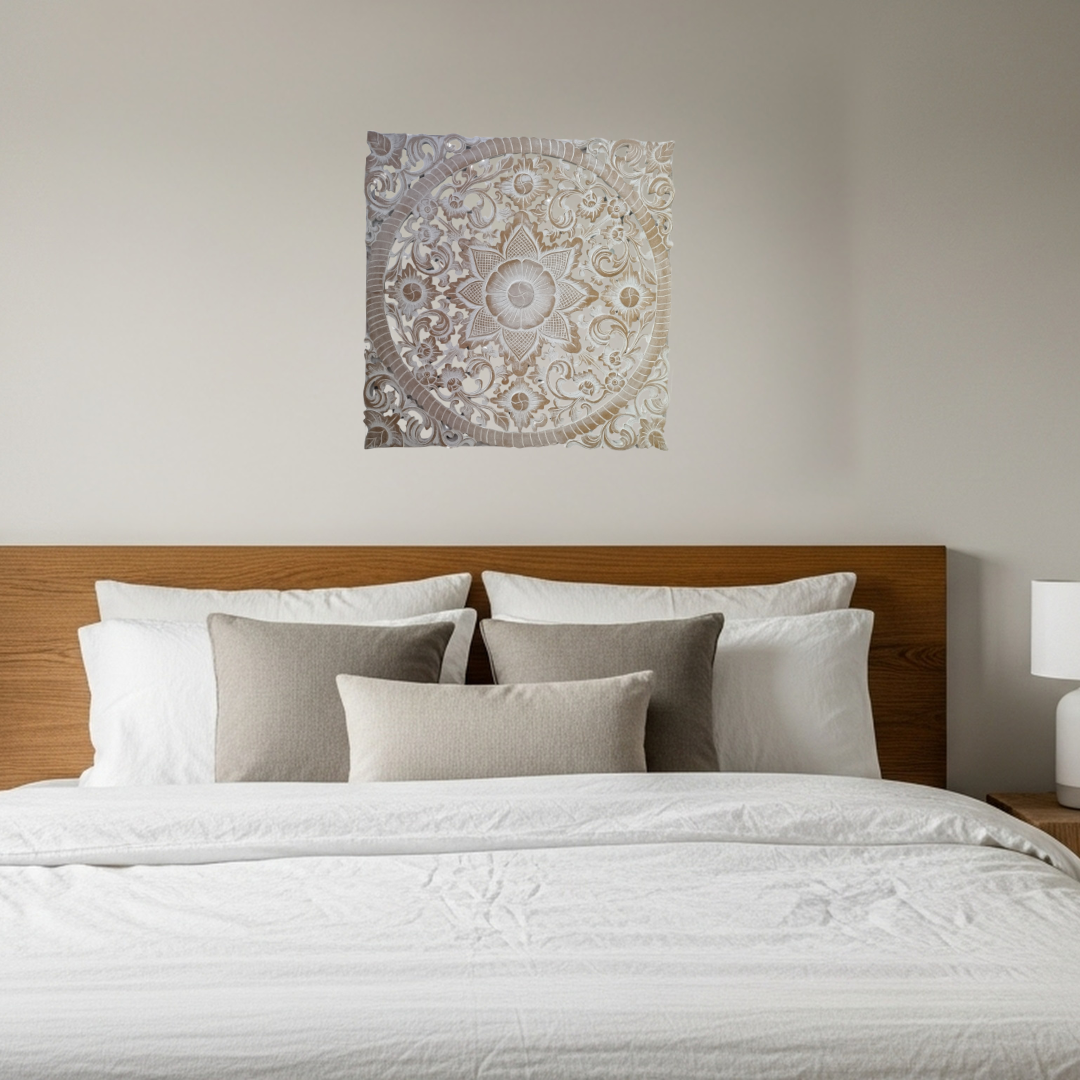 Bedroom with a wooden headboard, white bedding, and decorative wall art.