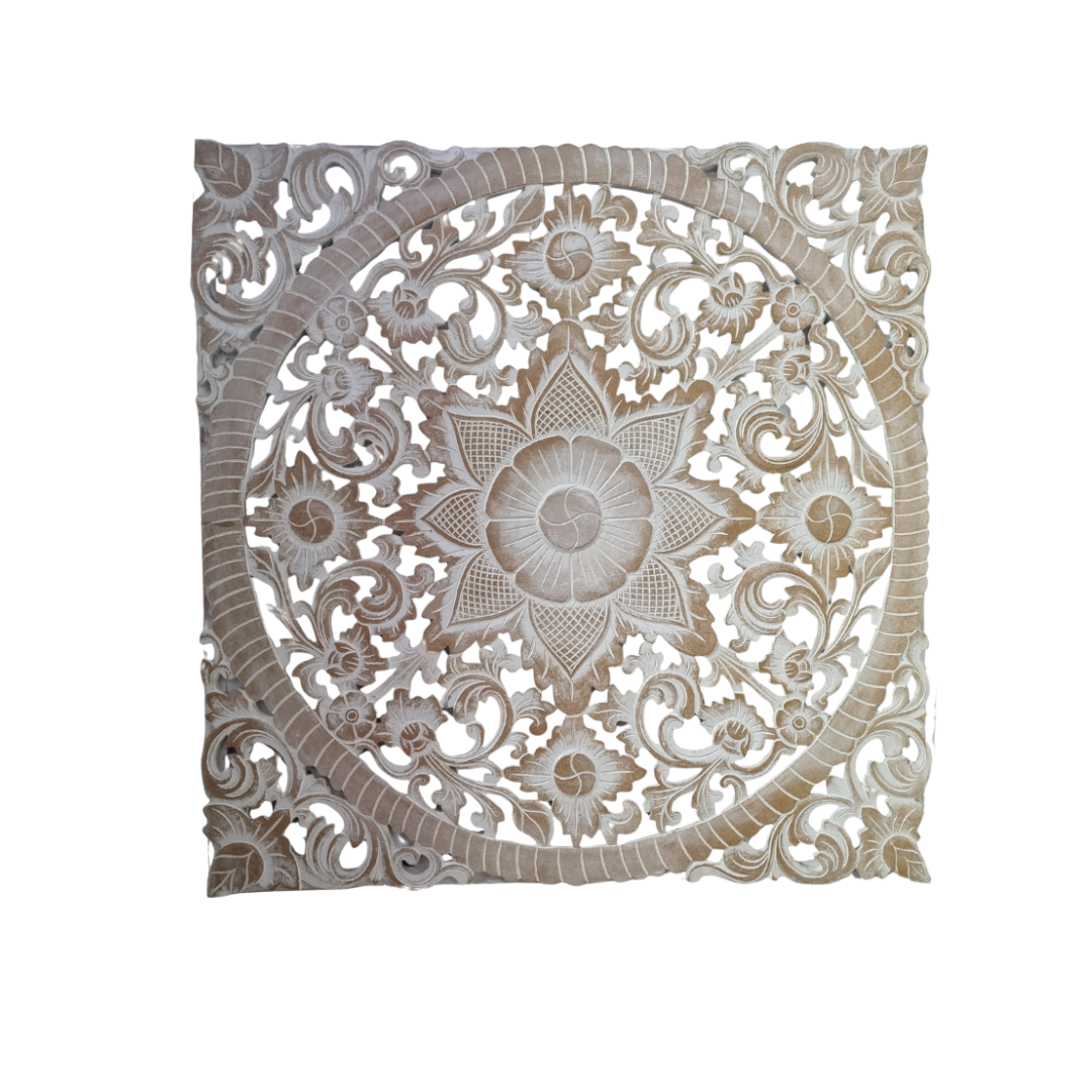 Decorative wall panel with intricate carvings on a white background