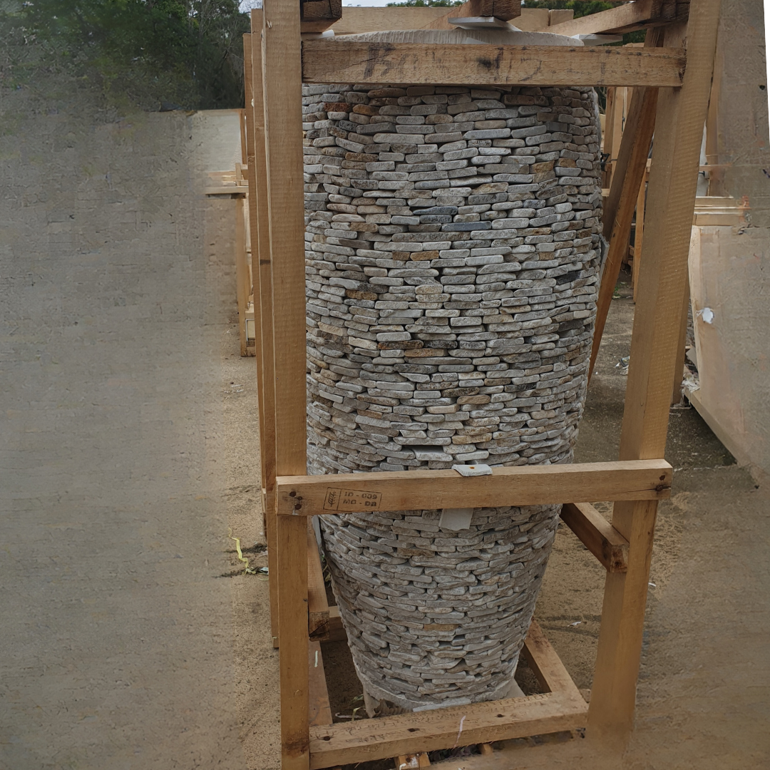 Stack of stone slabs on a wooden pallet outdoors