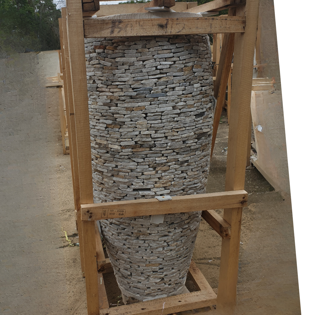 Stack of stone slabs on a wooden frame outdoors