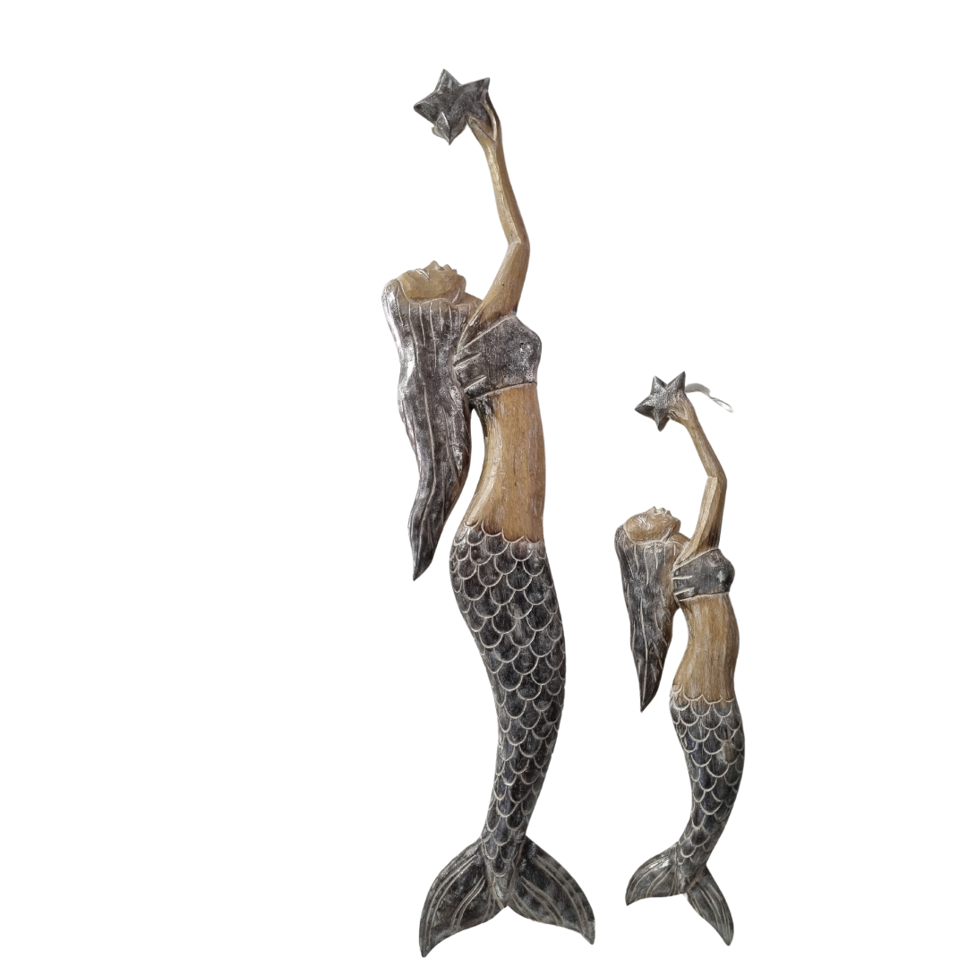 Handcrafted wooden mermaid wall art holding a starfish, displayed on a white wall, rustic coastal décor
