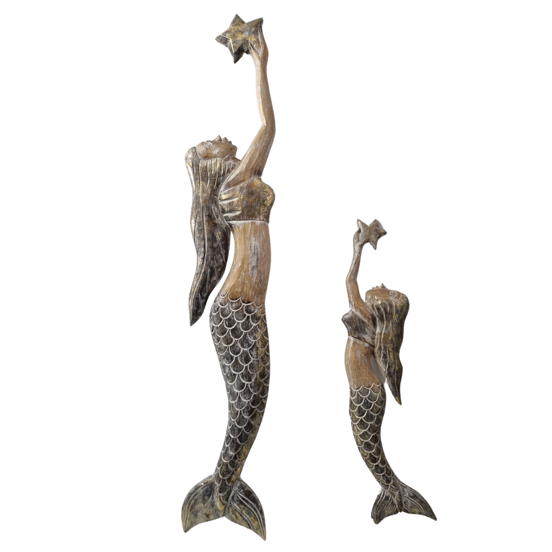 two mermaids 1 large 1x smallHandcrafted wooden mermaid wall art holding a starfish, displayed on a white wall, rustic coastal décor