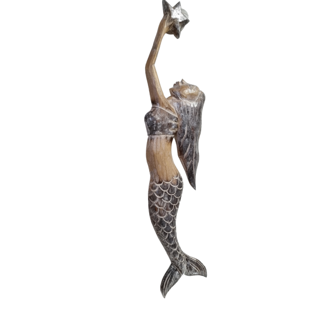 Handcrafted wooden mermaid wall art holding a starfish, displayed on a white wall, rustic coastal décor
