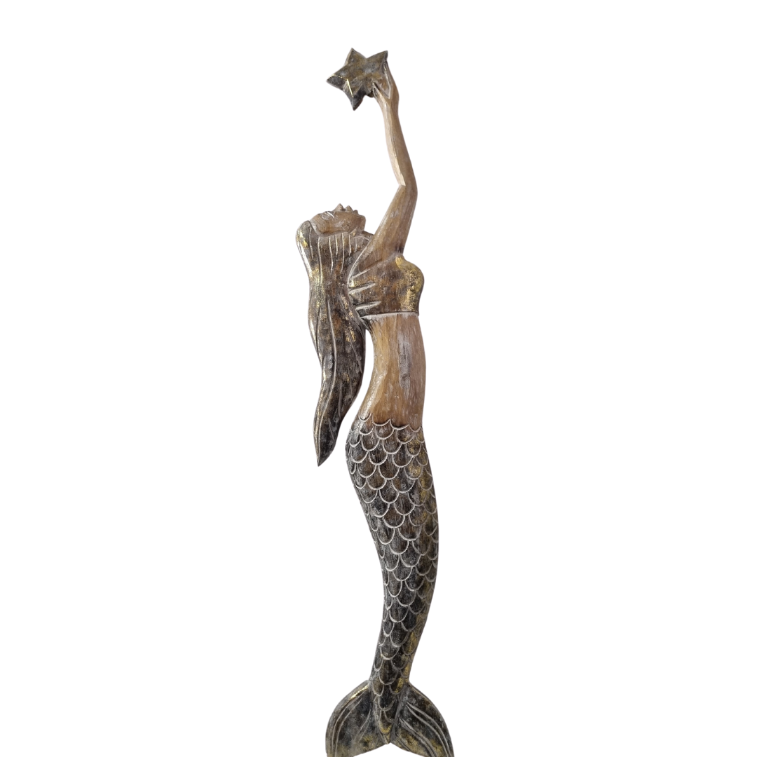 wooden mermaid carving holding a start fish on a white wall 