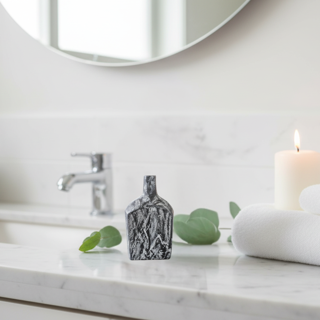 andcrafted small black timber bottle decor with white carved grain detail styled on a timber bookshelf with trailing pothos plant and linen books — 21 x 12cm