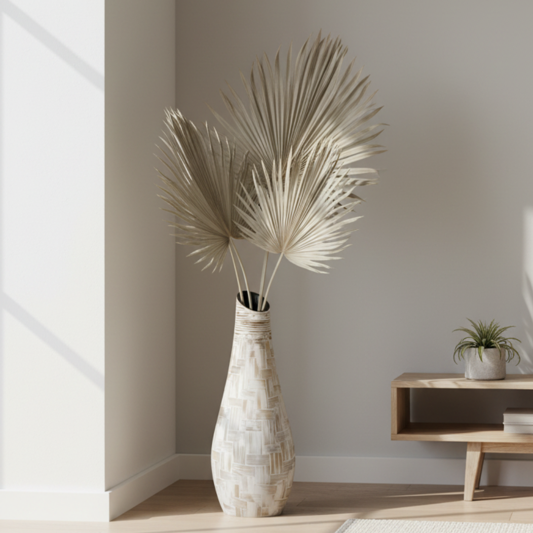 Decorative vase with dried palm leaves in a minimalistic room.