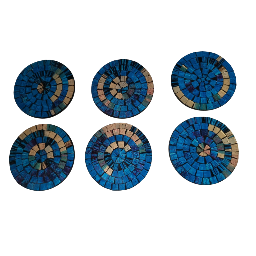 A set of round mosaic drink coasters in various blue colors
