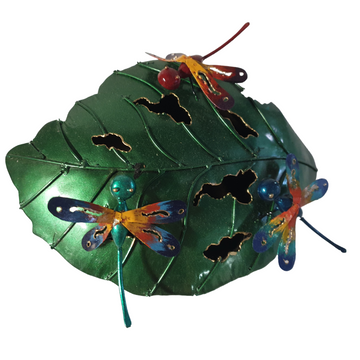 Handcrafted metal dragonflies on a white background.
