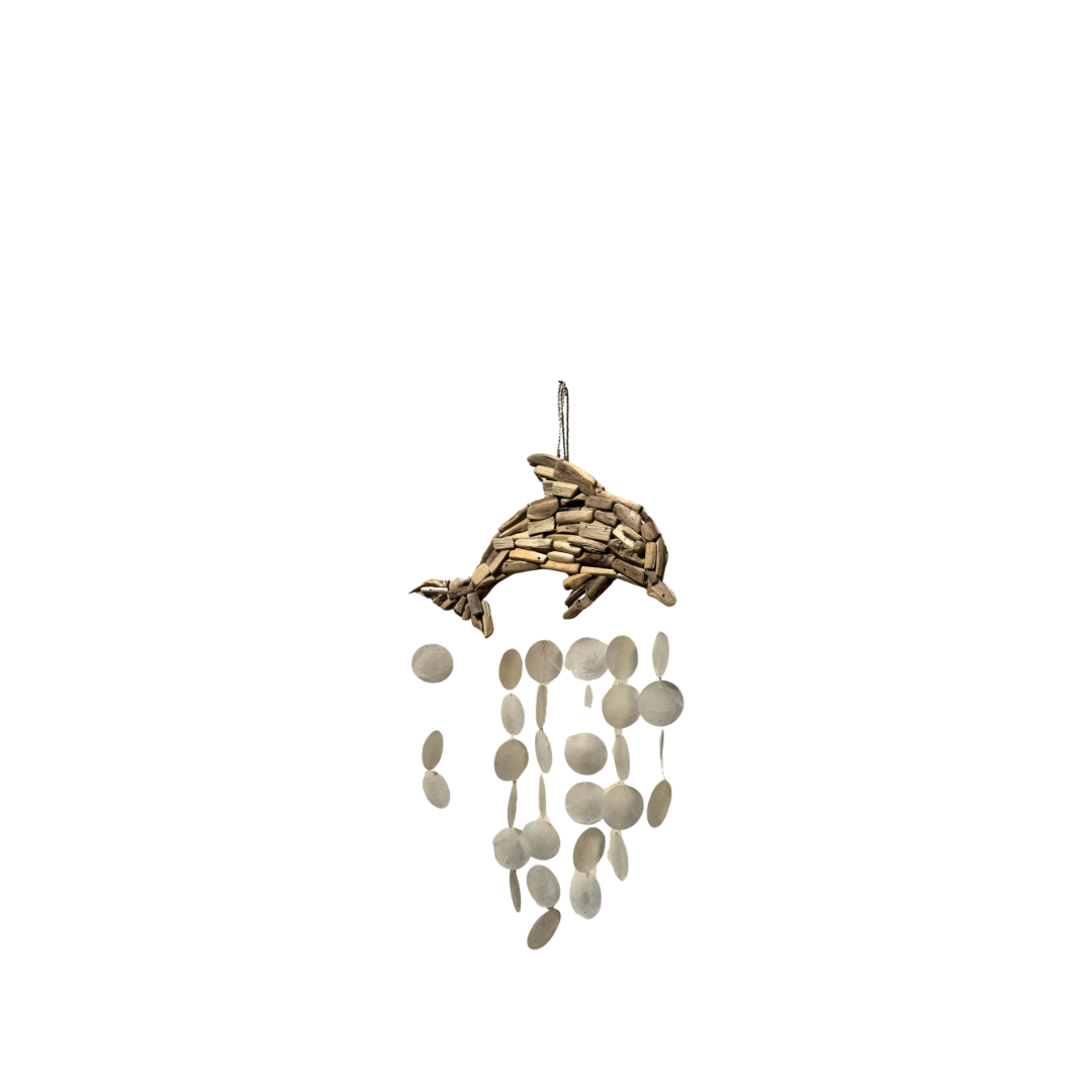 Dolphin hanging ornament made of layered wood-toned pieces, with dangling oval shell discs in light beige and white, shown on a plain white background.