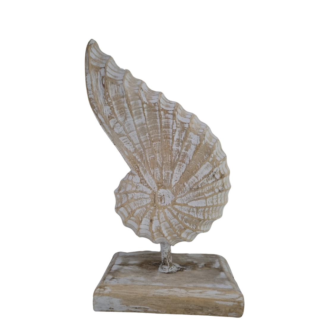 A handcrafted wooden conch shell decoration on a stand, with a natural white wash finish on beige back drop 