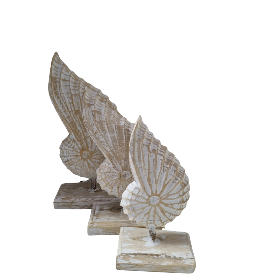3 wooden conch shell decor pieces all set on a stand on a white back ground 