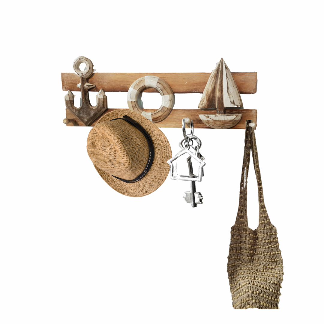 Wooden wall hook with decorative items including a hat, bag, and keychain on a white background