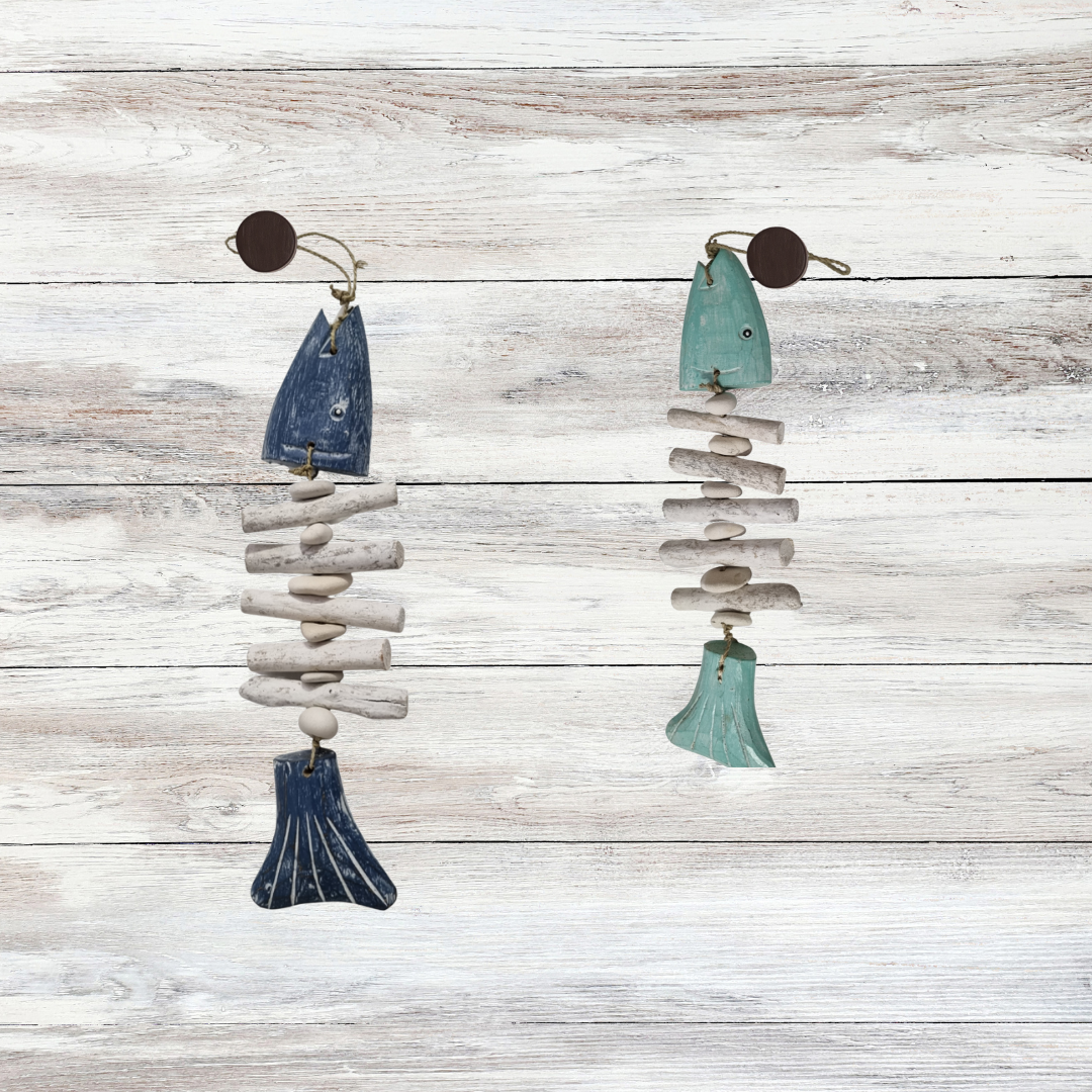 Pair of earrings with blue and white stone-like pendants on a wooden surface