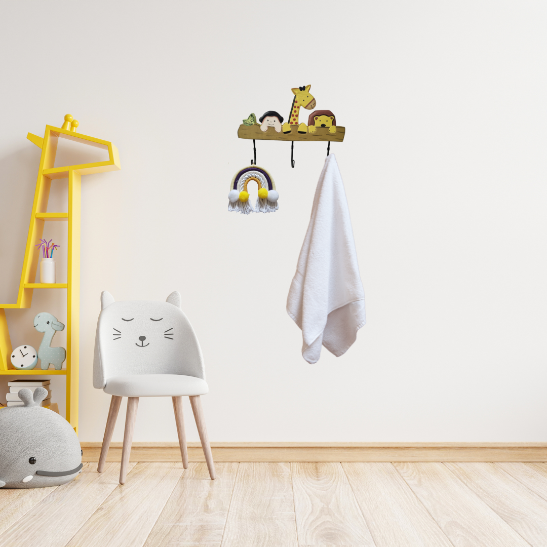 Children's room with a yellow shelf, white chair, and wall hooks with toys.