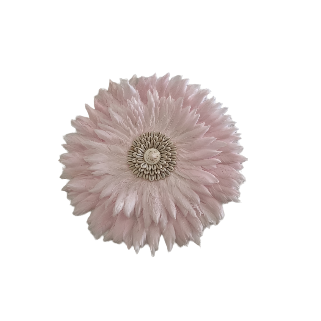 Pink flower-like decorative item on a white background