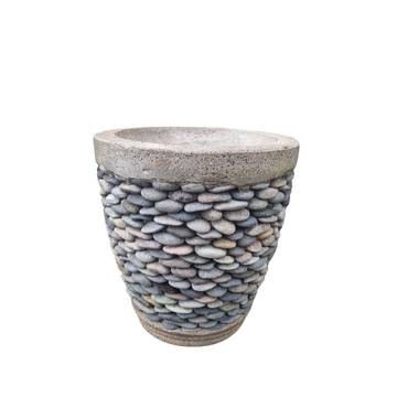 Decorative planter with pebbles and concrete top on a white background