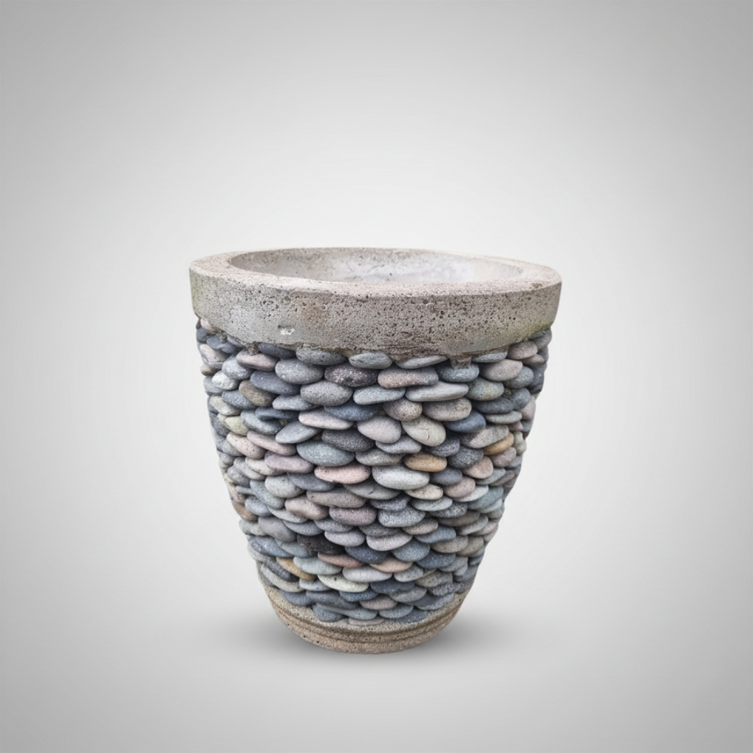 Pebble Concrete Pot Indoor Outdoor — three sizes grouped together in a tropical garden setting with monstera leaves