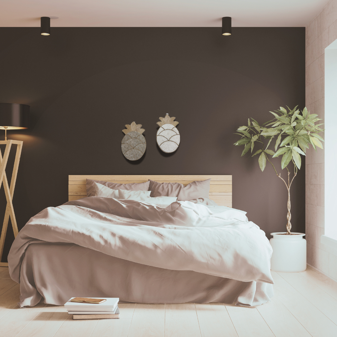 Modern bedroom with a bed, Pineapple Shell Wall Art decorations, and a plant.