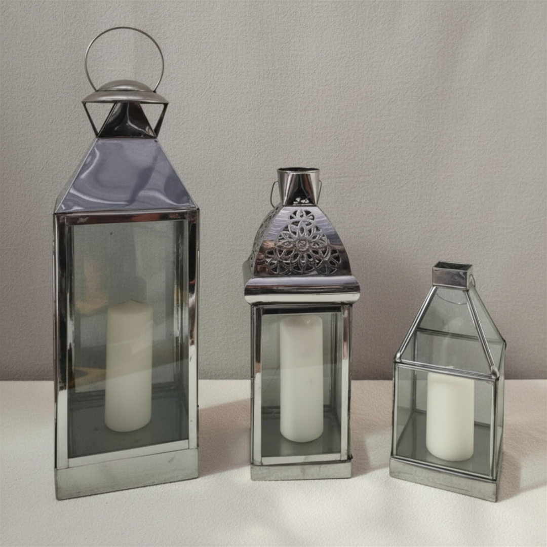 large, medium, and small sizes with white pillar candles, displayed together against a neutral grey background