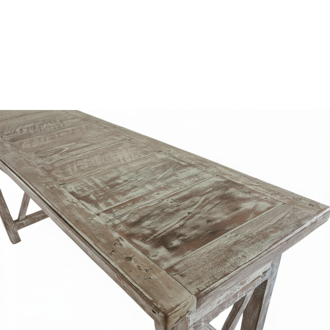 Close-up detail of reclaimed boat wood console table top showing natural grain, plank construction and distressed white paint finish"