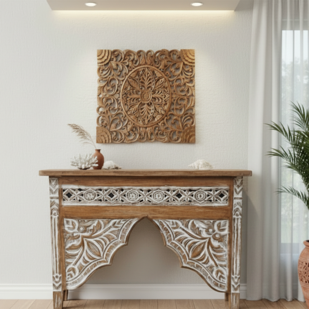 Decorative wooden console table with intricate carvings in a room setting.