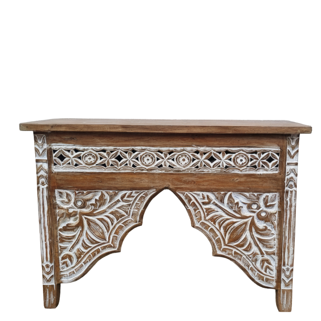 Wooden console table with intricate carvings on a white background