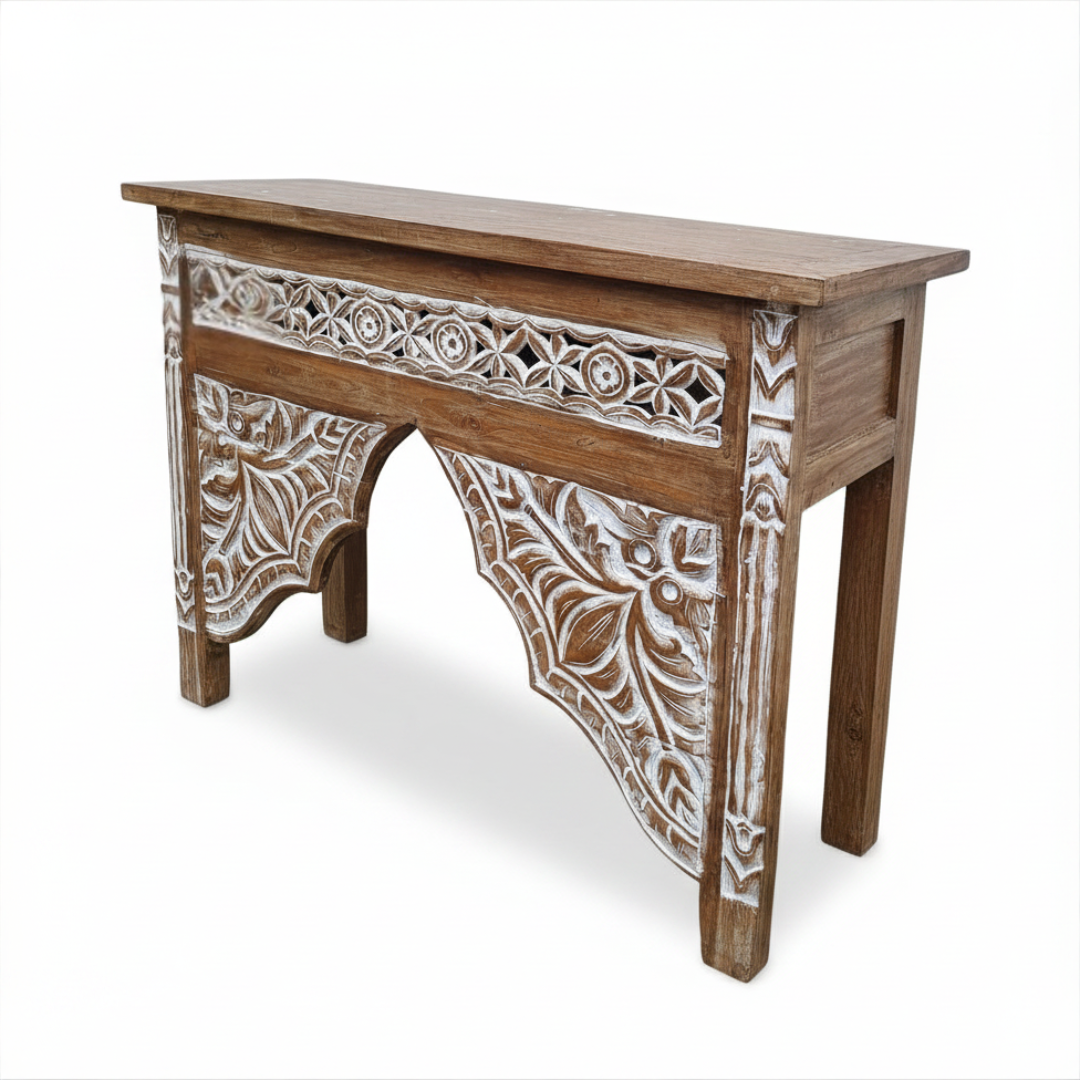 Wooden console table with intricate carvings on a white background