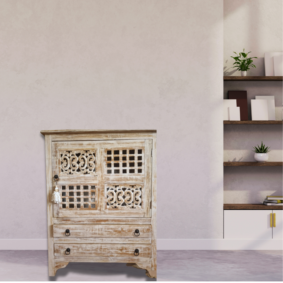 A rustic reclaimed teak wood cabinet with intricate carvings, featuring a white-wash finish and traditional hardware.