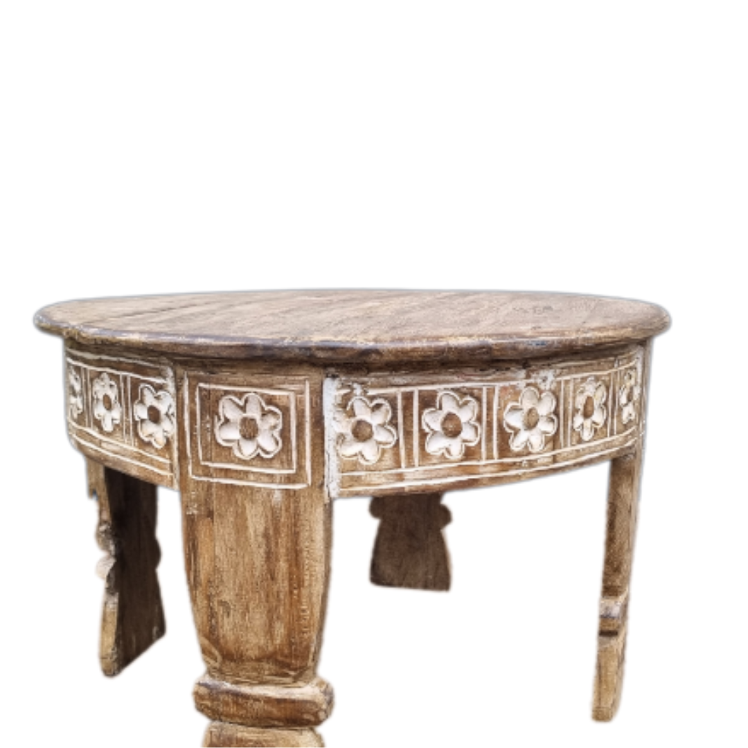 Wooden table with floral carvings on a white background