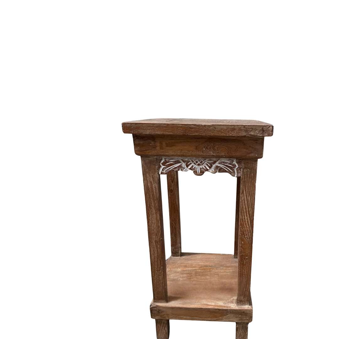 Wooden side table with decorative carvings on a white background