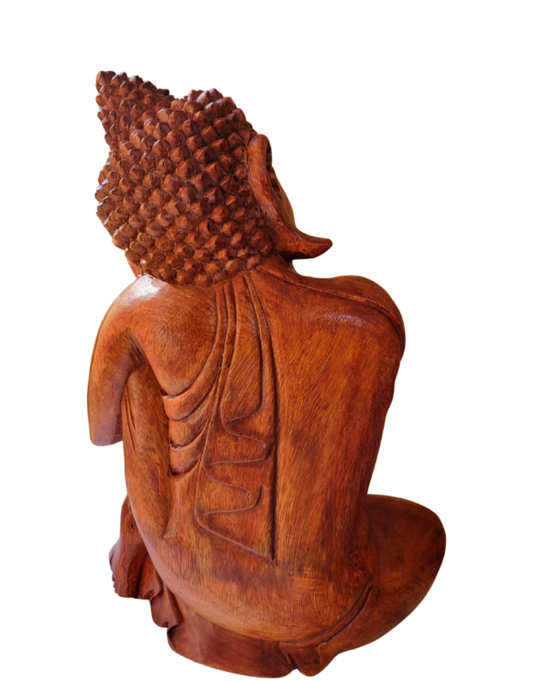 Wooden Buddha statue from behind on a white background