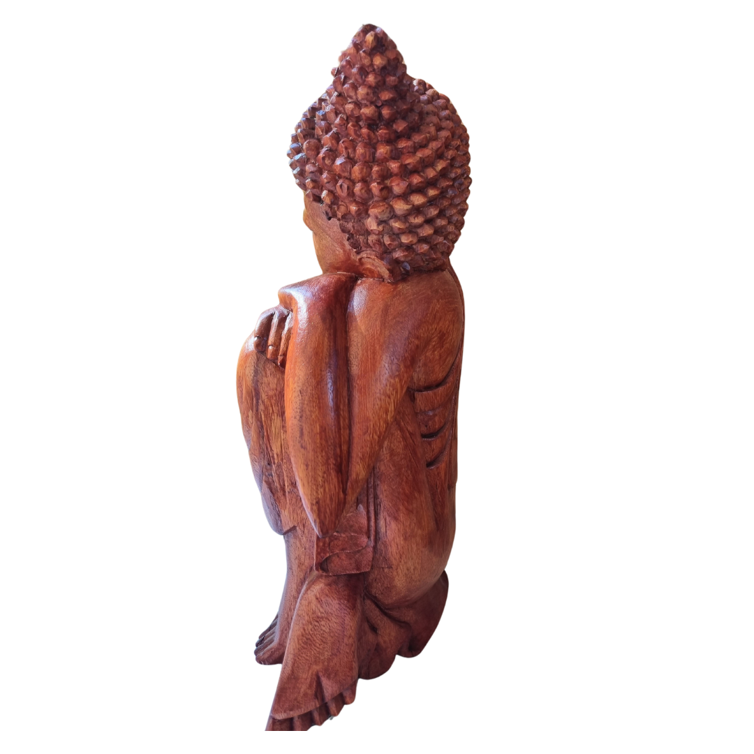 Wooden Buddha statue on a white background