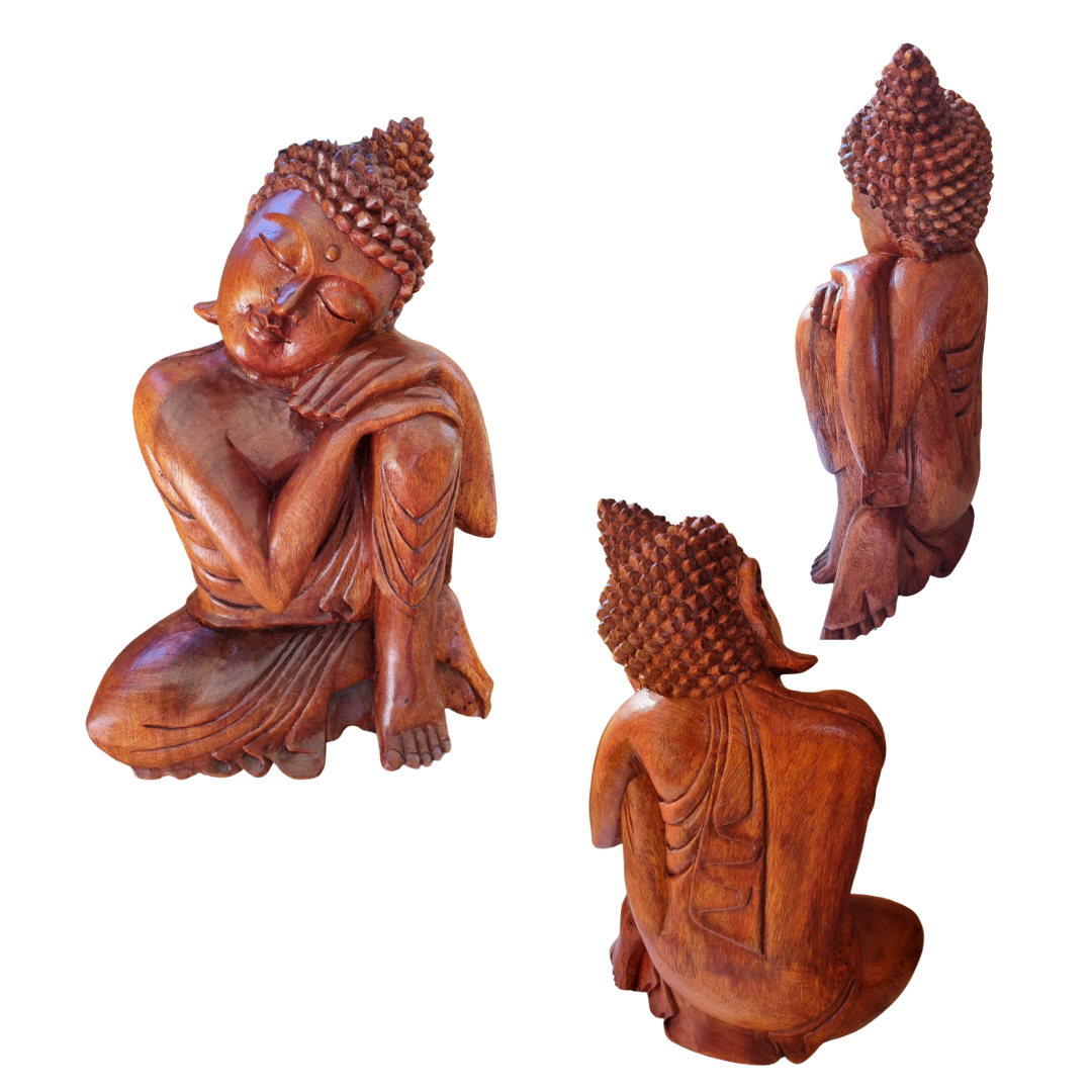 Three wooden Buddha statues on a white background