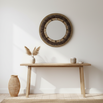 Deep Brown tone boho coastal wall mirror styled above a timber console table with pampas grass and rattan vase in a bright coastal hallway — round woven seagrass and dark rope frame with cowrie shell detail, 50x50cm — handcrafted coastal boho home decor by Azure Decor
