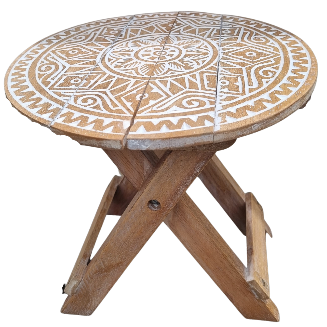 Small rustic boho foldable wooden picnic table with hand carved mandala tribal pattern and natural white wash finish, fully assembled front view with folding cross legs on white background — Boho Tribal Round design 30cm x 30cm by Azure Decor