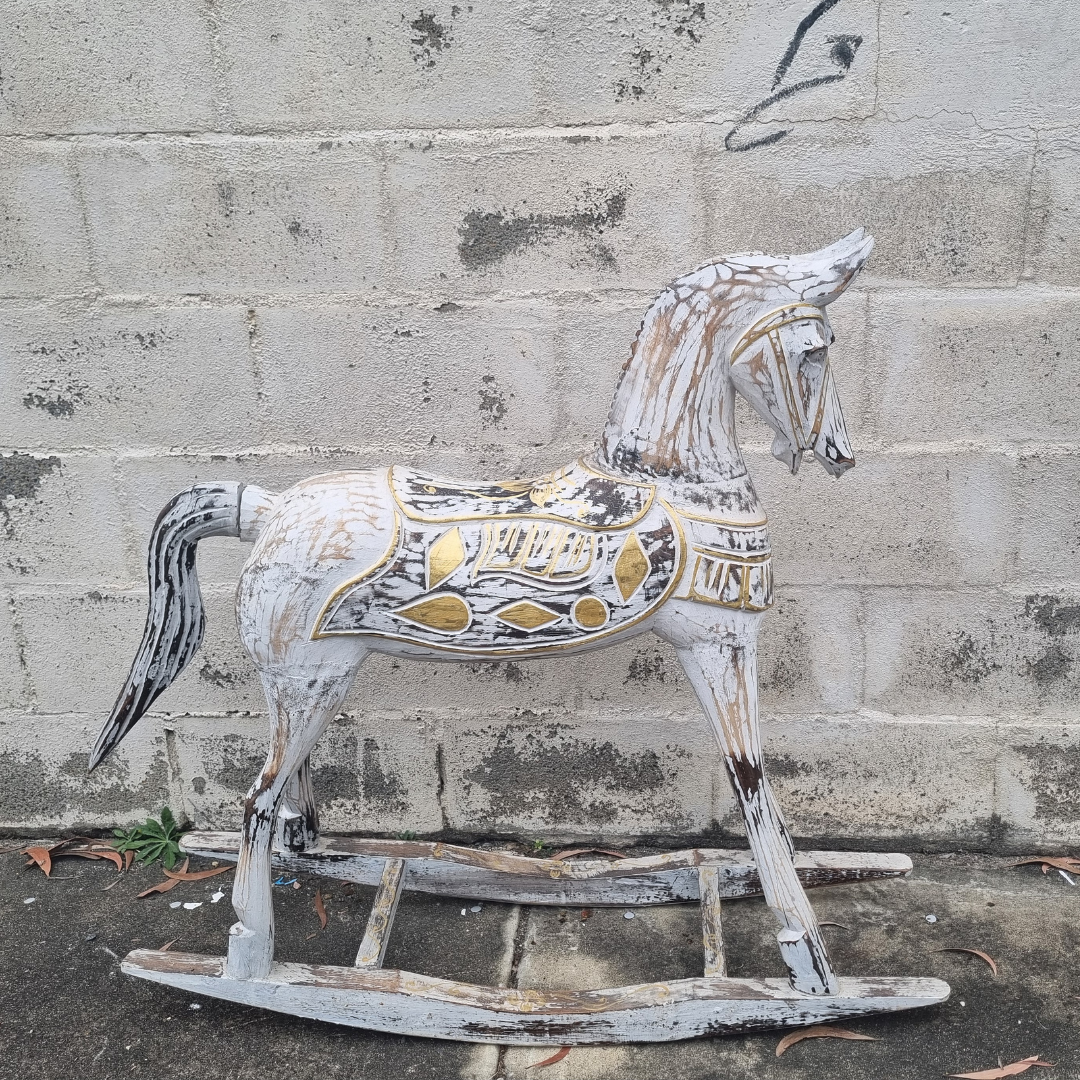 Rustic Rocking Horse Home Decor photographed outdoors showing distressed white and gold hand-carved body detailing