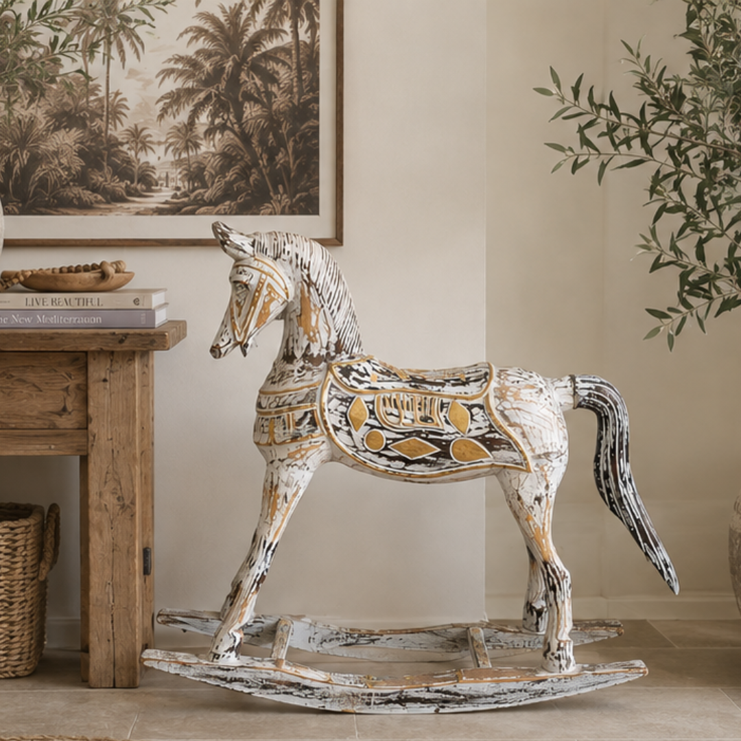 displayed in a warm neutral interior beside a timber console table, stacked books, and an olive tree 