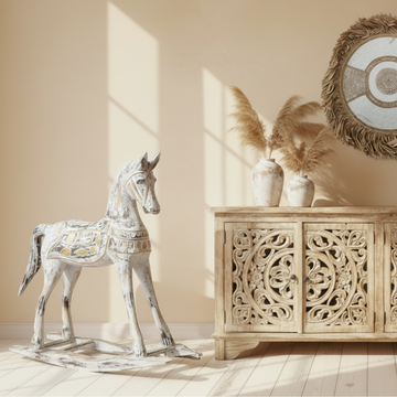 Rustic Rocking Horse Home Decor styled beside a carved timber sideboard with pampas grass and a raffia wall disc