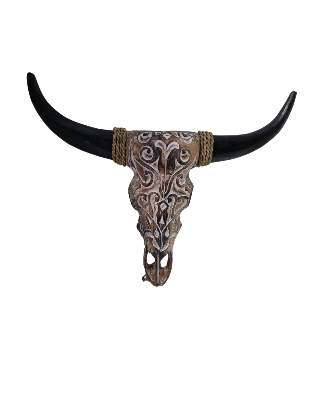 A handcrafted wooden bull skull with horns and facial features carved into the wood, with a whitewash finish.