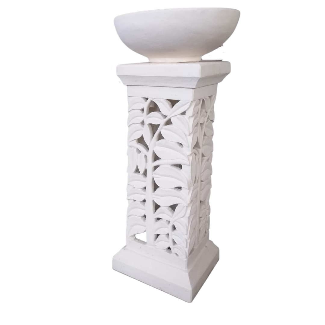 White decorative pedestal with a bowl on top against a white background