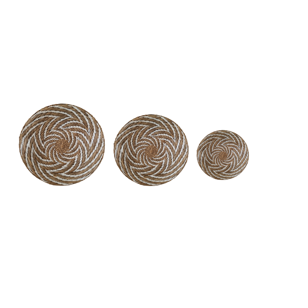 Three circular woven coasters with a spiral pattern on a white background