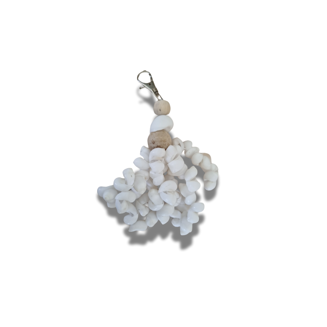 Seashell Serenity Tassel Decor with cascading white shells, wooden beads and silver metal clip on white background